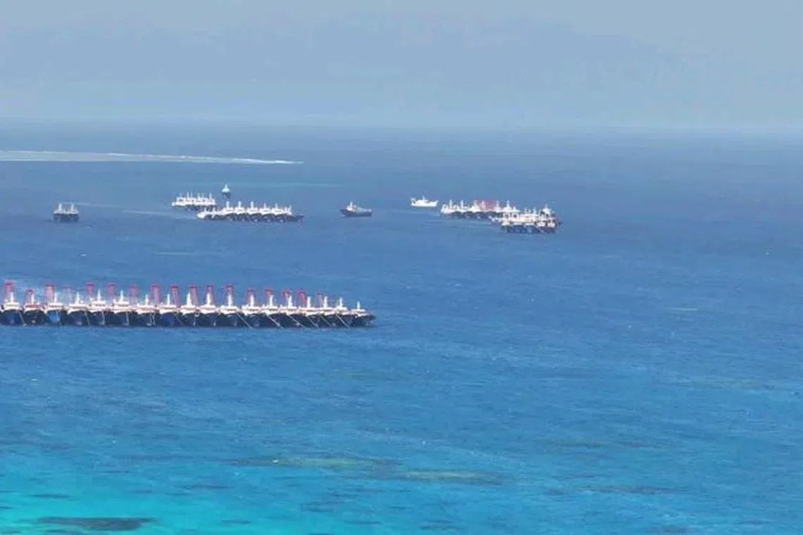 Chinese militia vessels operate at Whitsun Reef in the South China Sea, December 2, 2023. Philippine Coast Guard/Handout via REUTERS/File Photo