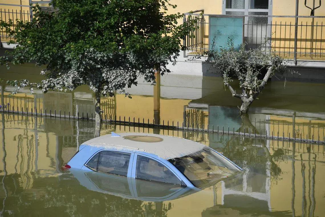 A flooded car in Faenza, near Ravenna, northern Italy on May 4, 2023. Two people died after 48 hours of almost continuous rain caused flooding in northern Italy, officials said.