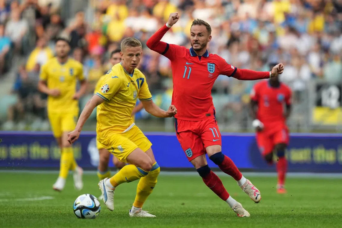 Ukraine's Oleksandr Zinchenko in action with England's James Maddison.