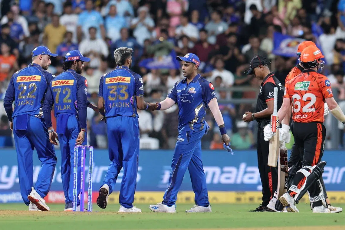 Cricket - Indian Premier League - IPL - Mumbai Indians v Sunrisers Hyderabad - Wankhede Stadium, Mumbai, India - April 29, 2026 Mumbai Indians' Hardik Pandya celebrates with teammate after taking the wicket of Sunrisers Hyderabad's Travis Head REUTERS/Francis Mascarenhas