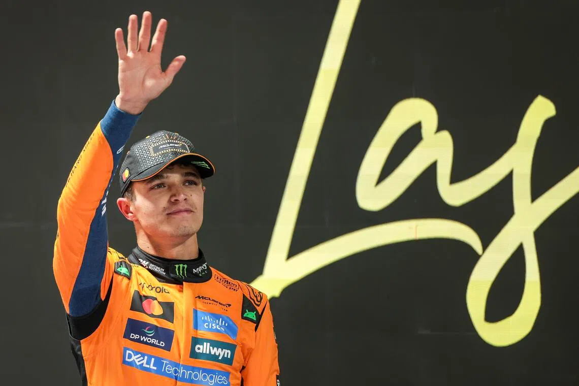 McLaren driver Lando Norris celebrates after qualifying in pole position for the Las Vegas Grand Prix.