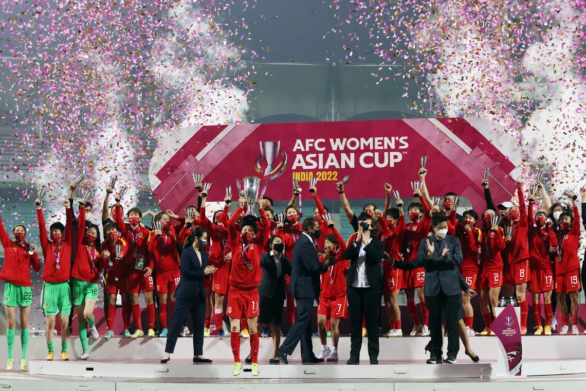 Soccer Football - Women's Asian Cup 2022 - Final - China v South Korea - D Y Patil Sports Stadium, Navi Mumbai, India - February 6, 2022 China captain Wang Shanshan holds the trophy and celebrates with team members after the match REUTERS/Francis Mascarenhas/File Photo