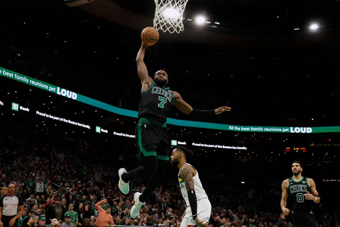 The Boston Celtics' Jaylen Brown goes in for a dunk against the Minnesota Timberwolves during the second half at TD Garden. 