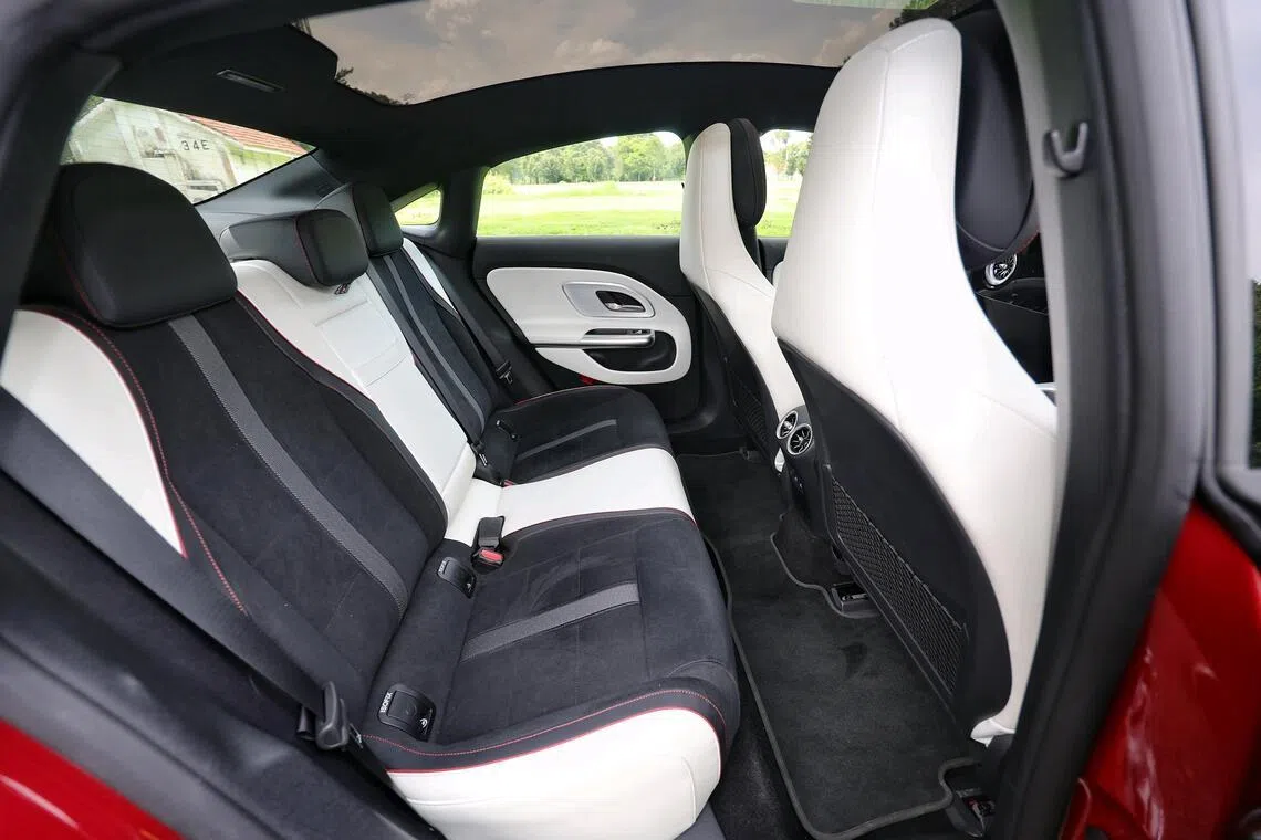 The rear headroom and legroom of the CLA 250+ remain tight beneath the sweeping roofline. 