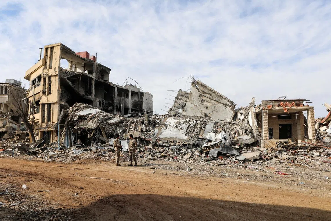 FILE PHOTO: Lebanese army members stand near rubble at a damaged site after the ceasefire between Israel and Hezbollah, in the Lebanese village of Khiam, December 23, 2024. REUTERS/Karamallah Daher/File Photo