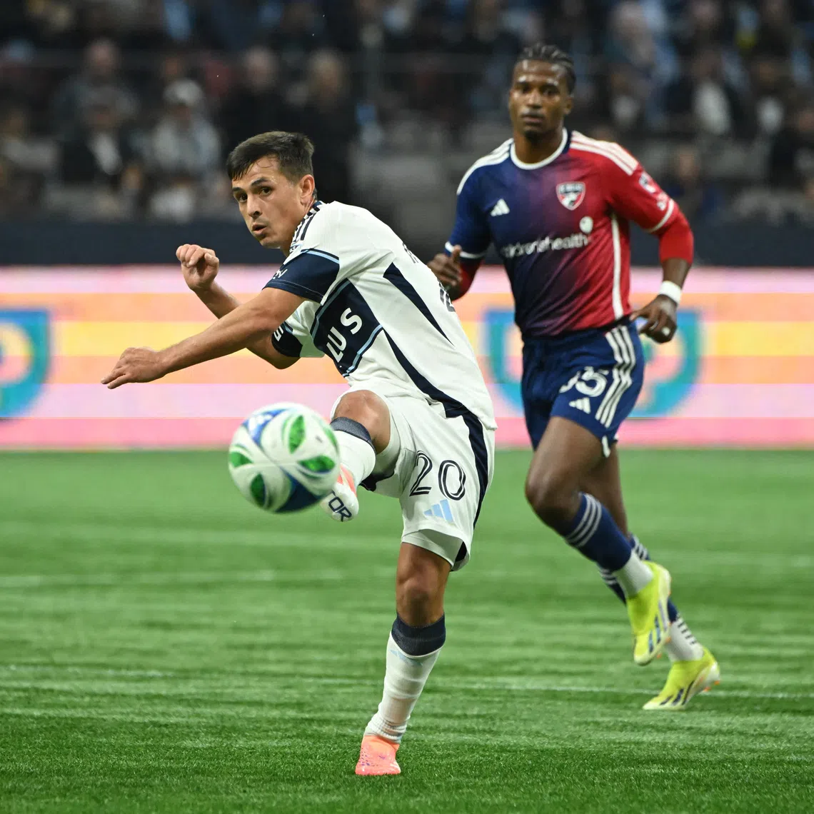 FILE PHOTO: Oct 26, 2025; Vancouver, British Columbia, CAN; Vancouver Whitecaps FC midfielder Andres Cubas (20) passes the ball during the first half against FC Dallas at BC Place. Mandatory Credit: Simon Fearn-Imagn Images/File Photo