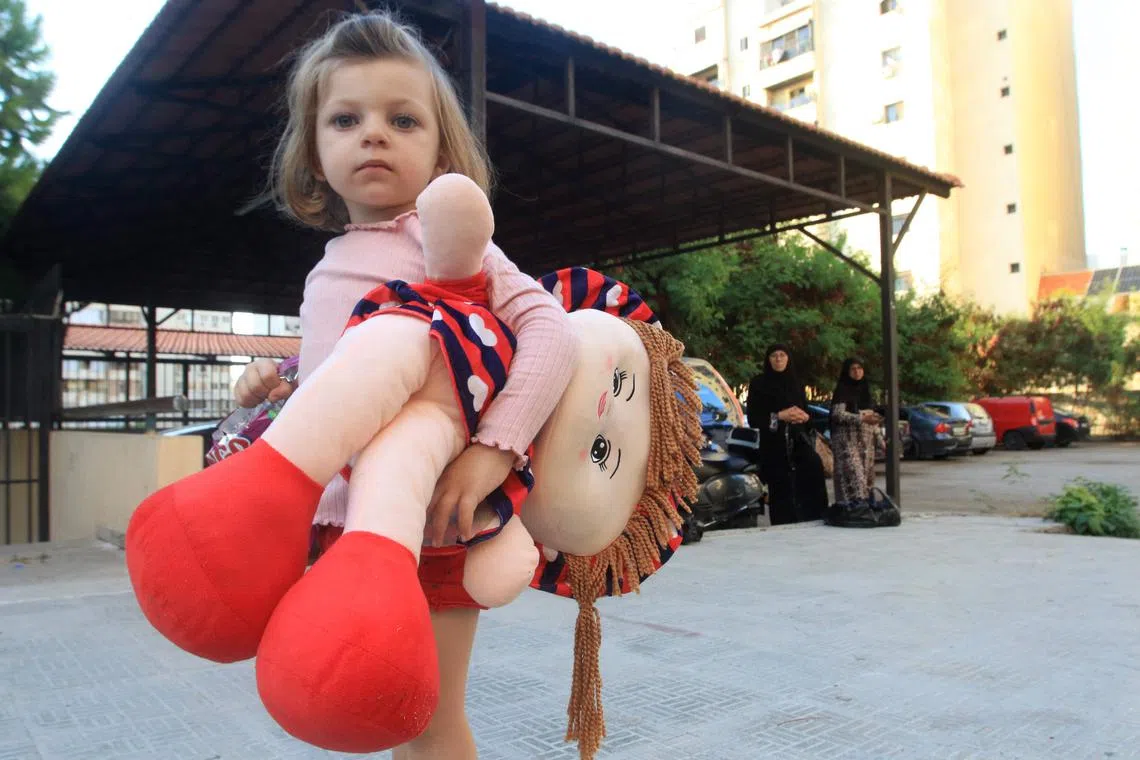 A Lebanese girl who fled with her family from their village in southern Lebanon, takes refuge at a public school in the Sidon.