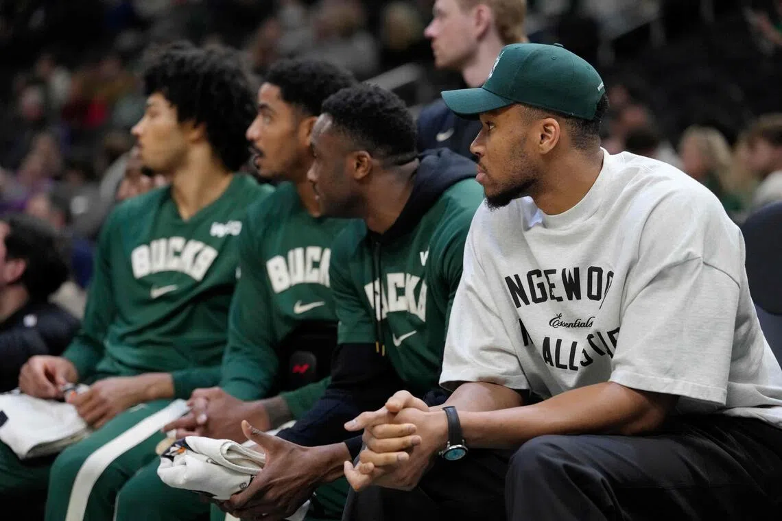 Giannis Antetokounmpo (right) of the Milwaukee Bucks sitting on the bench during the 133-101 NBA defeat by the Boston Celtics at Fiserv Forum on April 3, 2026 in Milwaukee, Wisconsin. 