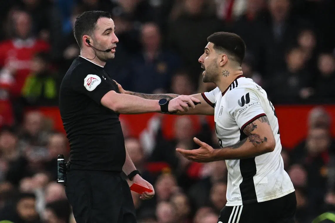 Fulham's Aleksandar Mitrovic's clash with referee Chris Kavanagh gets him sent off during the FA Cup quarter-final defeat by Manchester United.