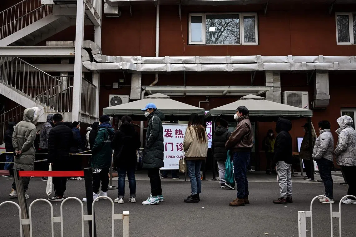 People queue at a fever clinic to be tested for the Covid-19 in Beijing on Dec 9, 2022.