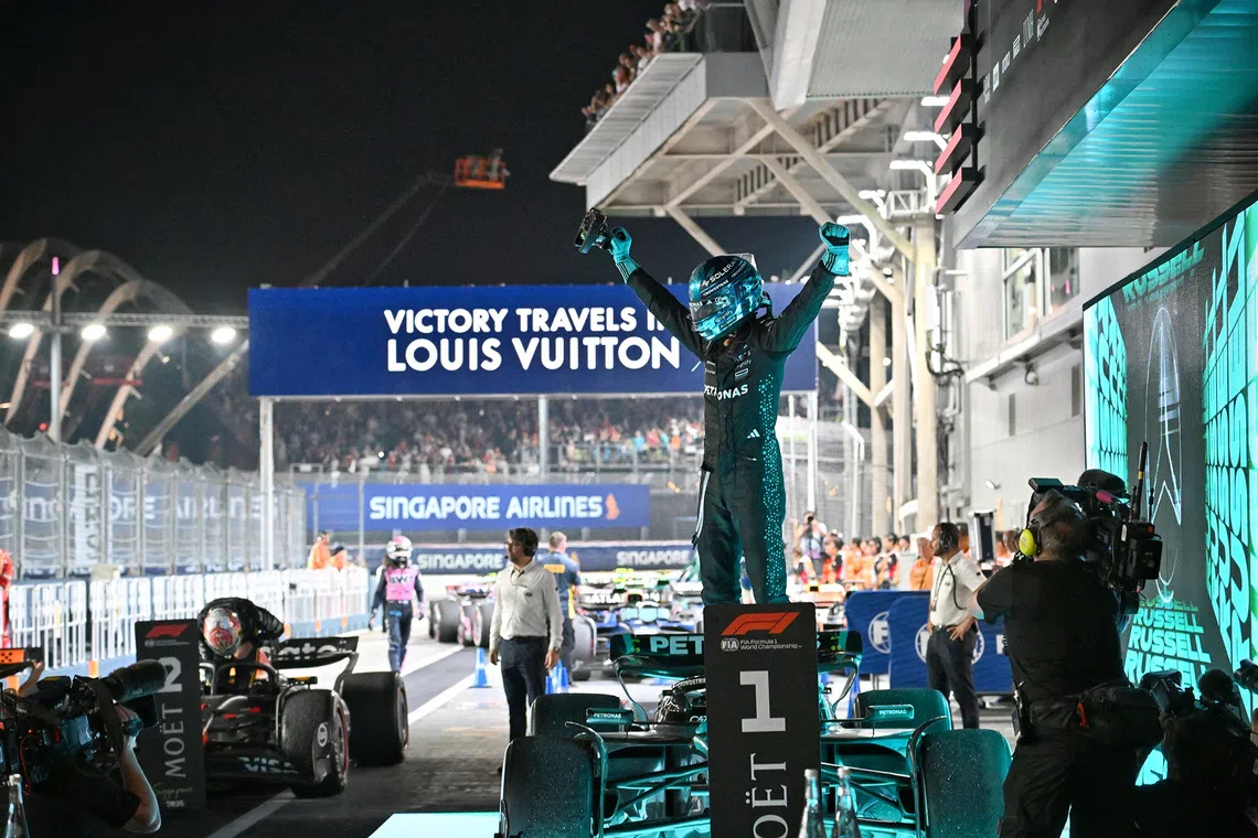 A jubilant George Russell of Mercedes reacting after winning the 2025 Formula One Singapore Airlines Singapore Grand Prix at the Marina Bay Street Circuit on Oct 5, 2025. 