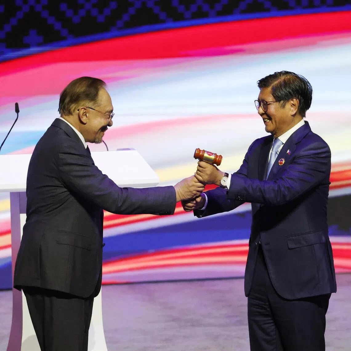 Malaysia's Prime Minister Anwar Ibrahim (left) passing the Asean chairmanship to Philippine President Ferdinand 'Bongbong' Marcos Jr.