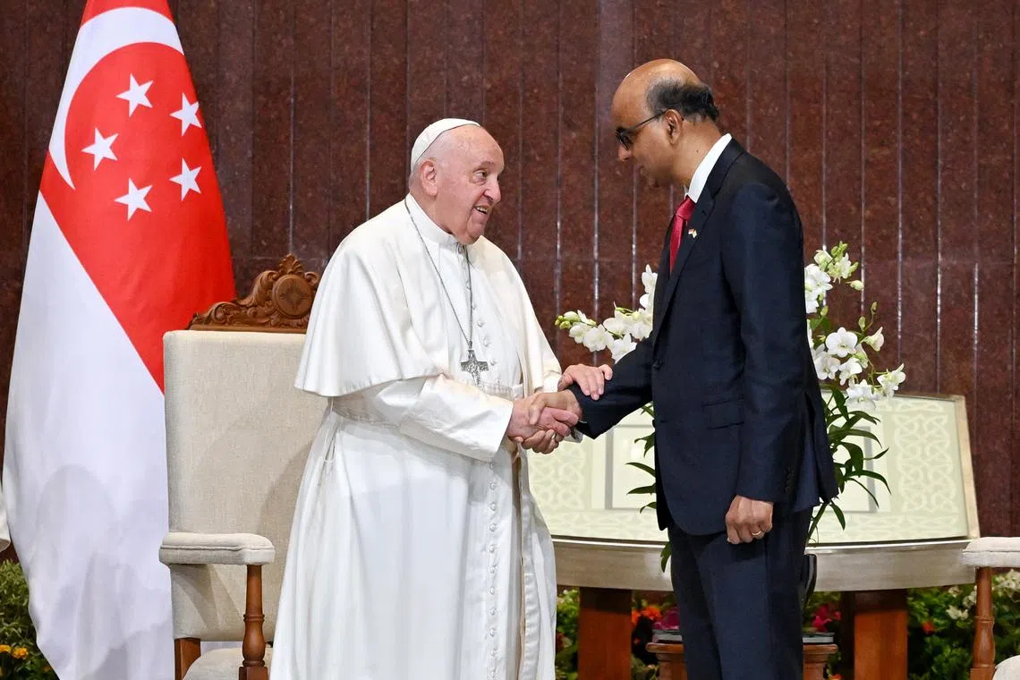 Pope Francis and President Tharman Shanmugaratnam greeting each other at Parliament House on Sept 12, 2024.