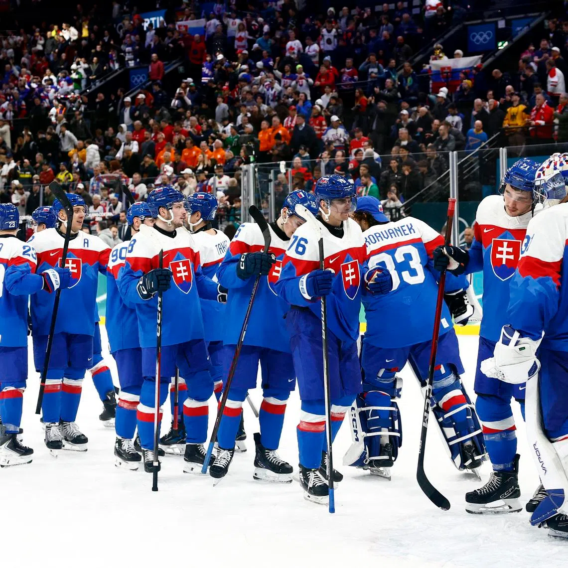 Milano Cortina 2026 Olympics - Ice Hockey - Men's Play-offs Quarterfinals - Slovakia vs Germany - Milano Santagiulia Ice Hockey Arena, Milan, Italy - February 18, 2026. Slovakia players celebrate after the match REUTERS/Alessandro Garofalo