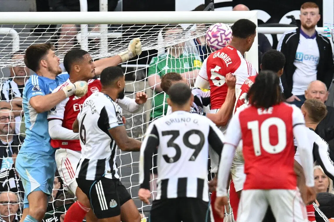 Arsenal's Brazilian defender Gabriel Magalhaes heading in their late winner during the 2-1 English Premier League triumph over Newcastle United at St James' Park in Newcastle-upon-Tyne on Sept 28, 2025.