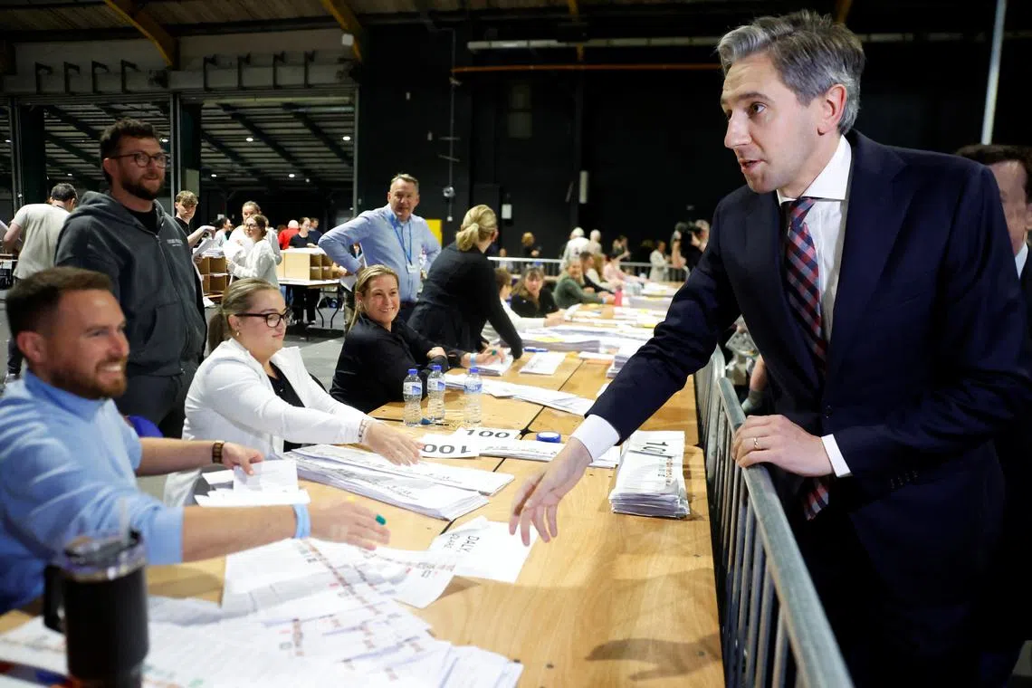 Taoiseach (Prime Minister) Simon Harris greets electoral workers at a European Parliament count centre, in Dublin, Ireland, June 9, 2024. REUTERS/Clodagh Kilcoyne/ File Photo