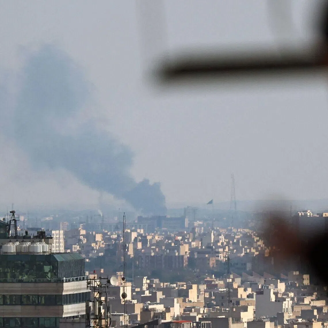 Smoke rises from the site of a strike in Tehran on April 1, 2026. 
