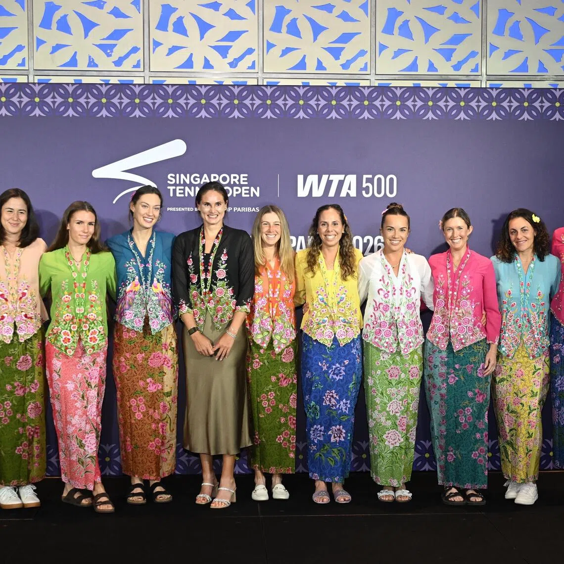 Players posing for photos in their kebayas at the Singapore Tennis Open welcome party at Hilton Singapore Orchard on Sept 20.