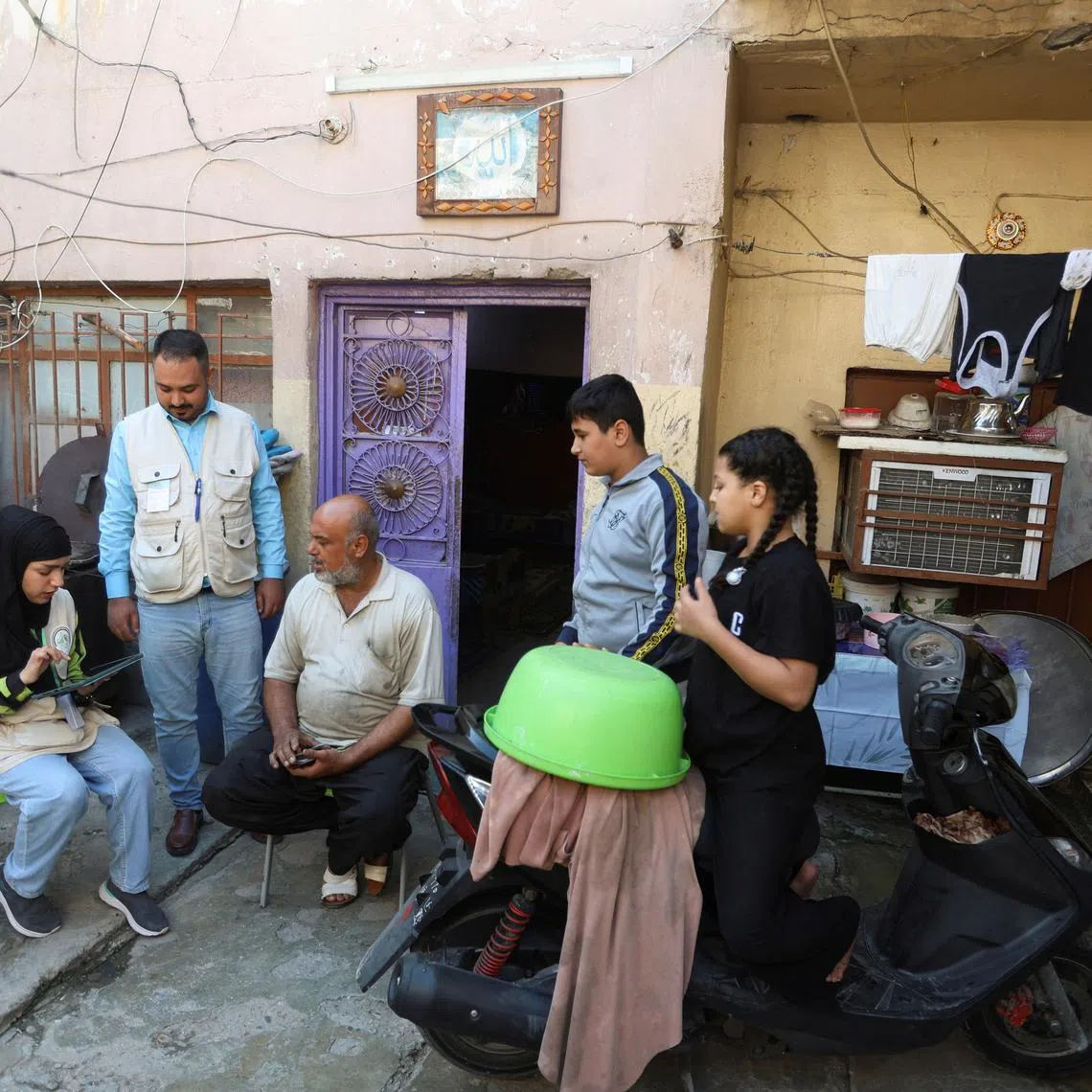A member of an Iraqi Planning Ministry team carries out the national population census, during a two-day curfew imposed for it to take place, in Baghdad, Iraq November 20, 2024. REUTERS/Ahmed Saad/File Photo