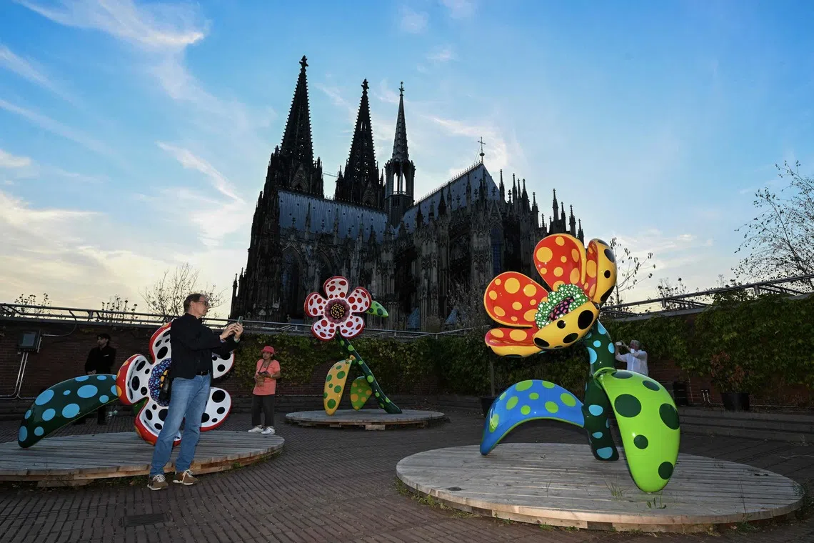 Yayoi Kusama’s Flowers That Speak all about my Heart Given to the Sky at the Museum Ludwig in Cologne, Germany, on Aug 2.