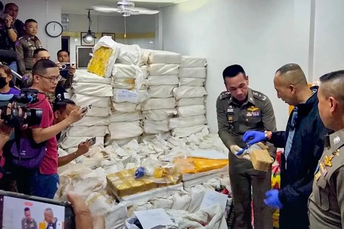 Thailand's newly appointed National Police chief Torsak Sukwimol (second from right) shows reporters some S$11 million worth of drugs seized on Sept 29, 2023.