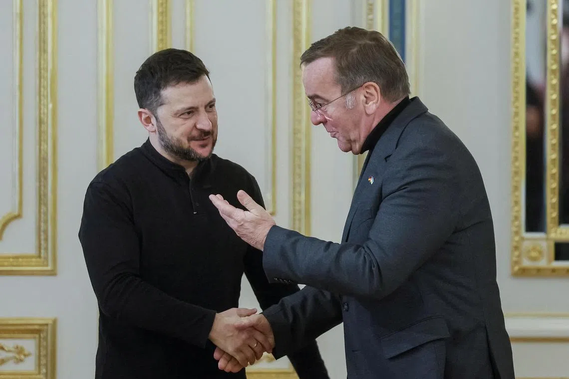 Ukrainian President Volodymyr Zelensky (left) welcoming German Defence Minister Boris Pistorius to Kyiv, on Jan 14.