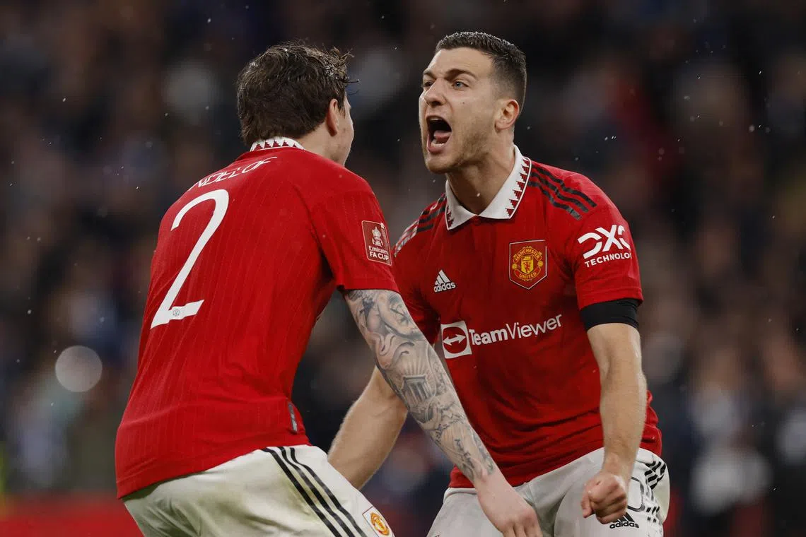 Manchester United's Victor Lindelof celebrates after scoring the penalty to win the penalty shootout.