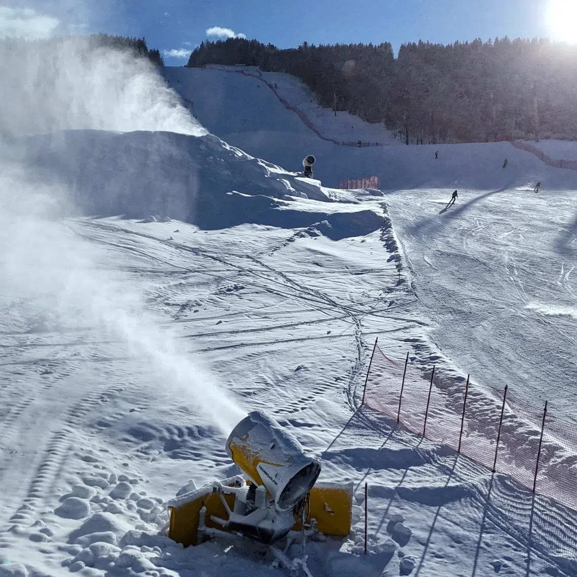 FILE PHOTO: TechnoAlpin snow cannons are pictured in action in Bormio, which will host the men's alpine skiing competition during the Milano Cortina Winter Olympic Games 2026, in Bormio, Italy, January 29, 2025. REUTERS/Claudia Greco/File Photo