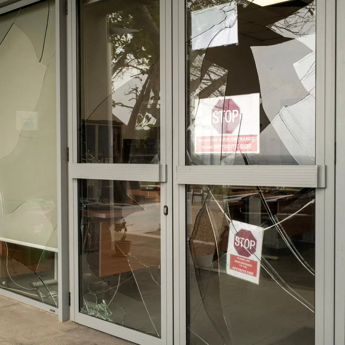 Shattered glass at a building of UN Interim Force in Lebanon that it says was caused by a Hezbollah rocket impact on March 23.