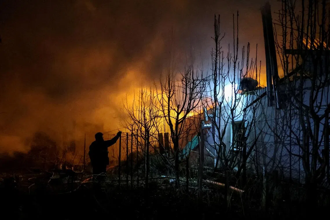 FILE PHOTO: Rescuers work at the site of a building destroyed during a Russian air strike, amid Russia's attack on Ukraine, in Kherson, Ukraine March 14, 2025. REUTERS/Ivan Antypenko/File Photo