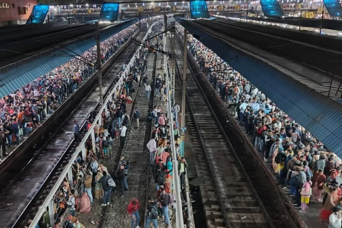 The rush at the train station appeared to break out as crowds struggled to board trains for the Kumbh Mela festival.