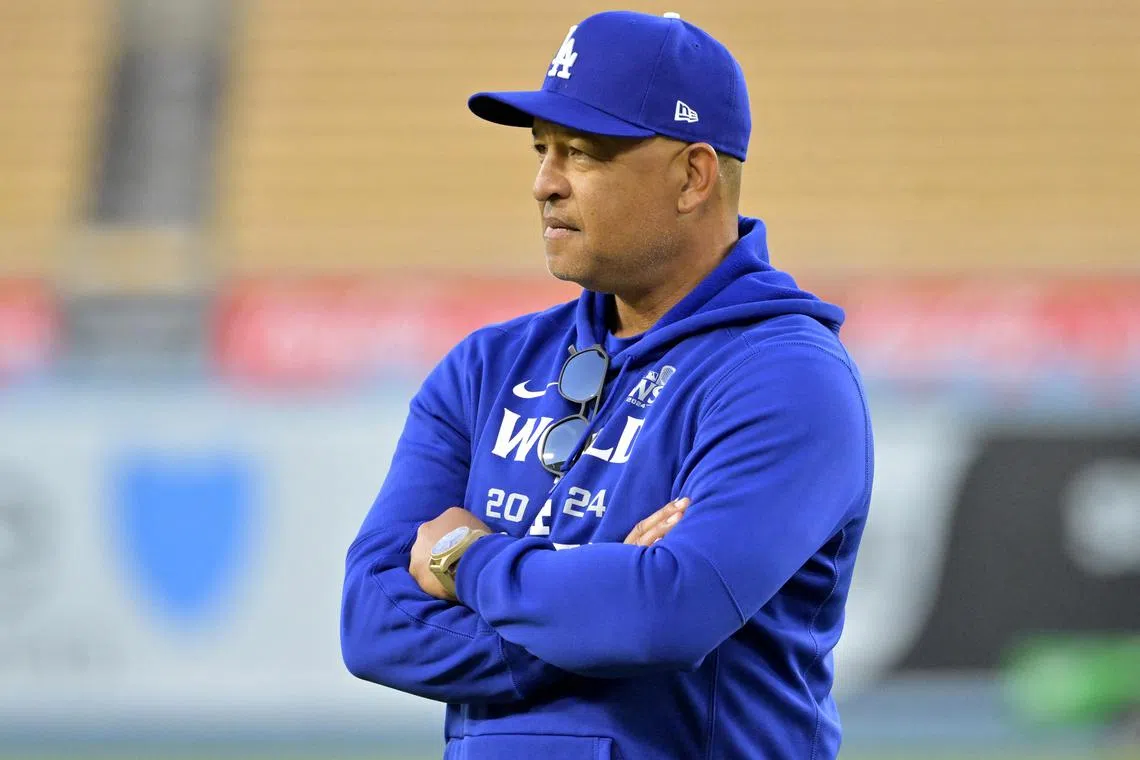 Oct 24, 2024; Los Angeles, CA, USA;  Los Angeles Dodgers manager Dave Roberts (30) looks on during the team workout prior to game one of the World Series against the New York Yankees at Dodger Stadium. Mandatory Credit: Jayne Kamin-Oncea-Imagn Images