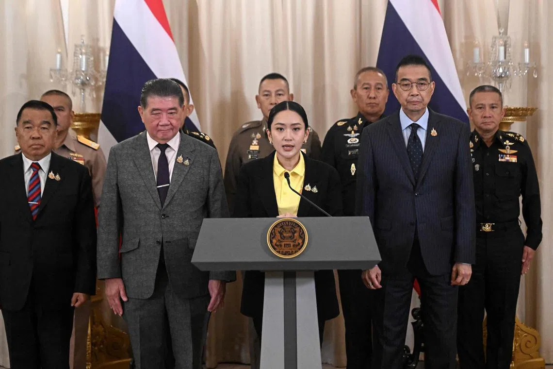 Thailand's Prime Minister Paetongtarn Shinawatra (centre) speaks at a press conference surrounded by senior Thai army commanders and government minsters at Government House in Bangkok on June 19, 2025. 