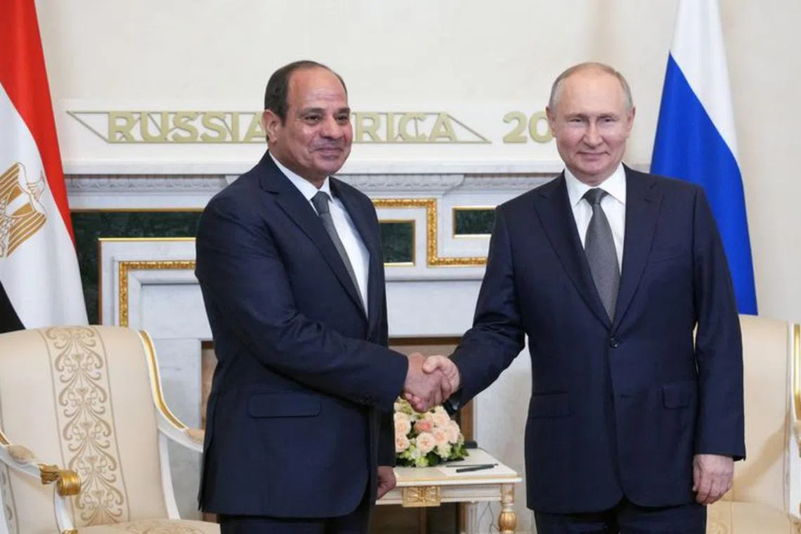 Russian President Vladimir Putin shakes hands with Egyptian President Abdel Fattah al-Sisi before a meeting on the sidelines of Russia-Africa summit in Saint Petersburg, Russia, July 26, 2023. Sputnik/Alexei Danichev/Pool via REUTERS/File Photo