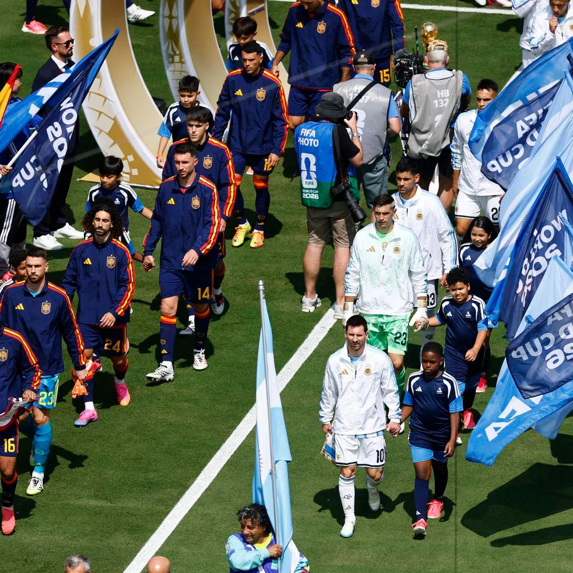 Soccer Football - FIFA World Cup 2026 - Final - Spain v Argentina - New York/New Jersey Stadium, East Rutherford, New Jersey, U.S. - July 19, 2026 Spain's Rodri and Argentina's Lionel Messi lead out their teams before the match REUTERS/Jeenah Moon