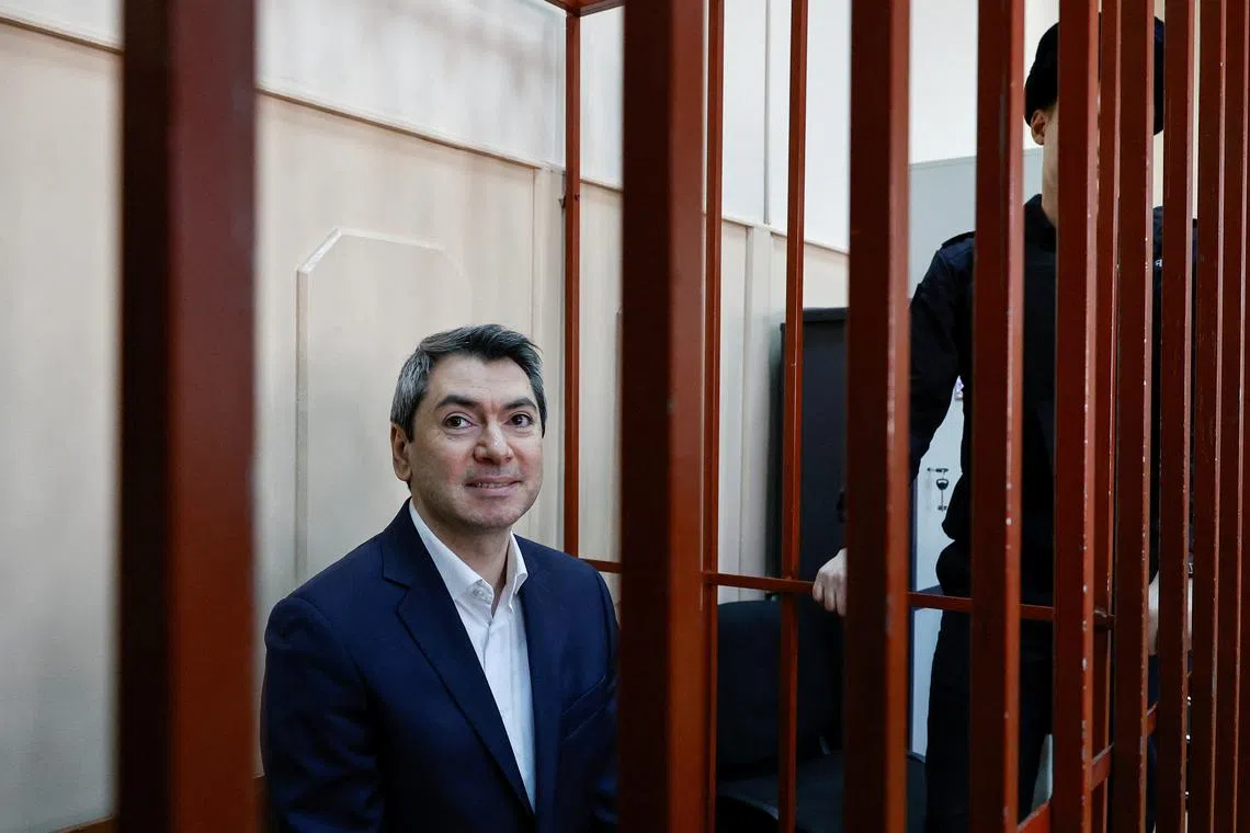 FILE PHOTO: Grigory Melkonyants, the co-chair of Russia’s election monitoring group Golos (Voice), who is in custody after he was accused of cooperating with an \"undesirable organisation\", reacts inside an enclosure for defendants before a court hearing in Moscow, Russia February 24, 2025. REUTERS/Yulia Morozova/File Photo