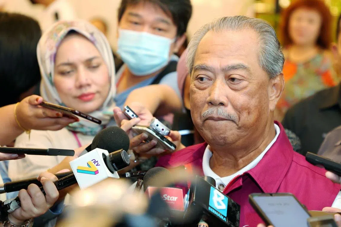 Tan Sri Muhyiddin Yassin speaking to reporters at Mid Valley Megamall in Kuala Lumpur on Feb 18, 2023.
