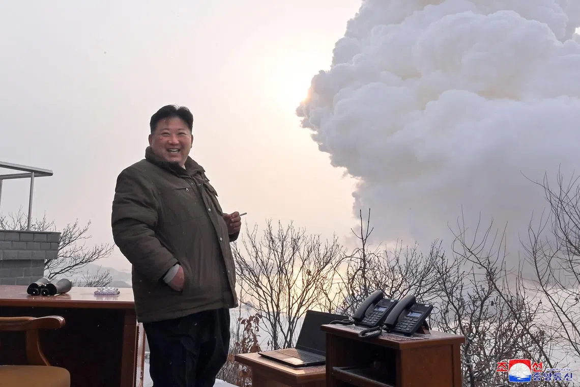 epa10368356 A photo released by the official North Korean Central News Agency (KCNA) shows North Korean Supreme Leader Kim Jong-un reacting after a ground test of a 'high-thrust solid-fuel motor', conducted at Sohae Satellite Launching Ground in Cholsan, North Pyongan Province, North Korea, 15 December 2022 (issued 16 December 2022).  EPA-EFE/KCNA   EDITORIAL USE ONLY