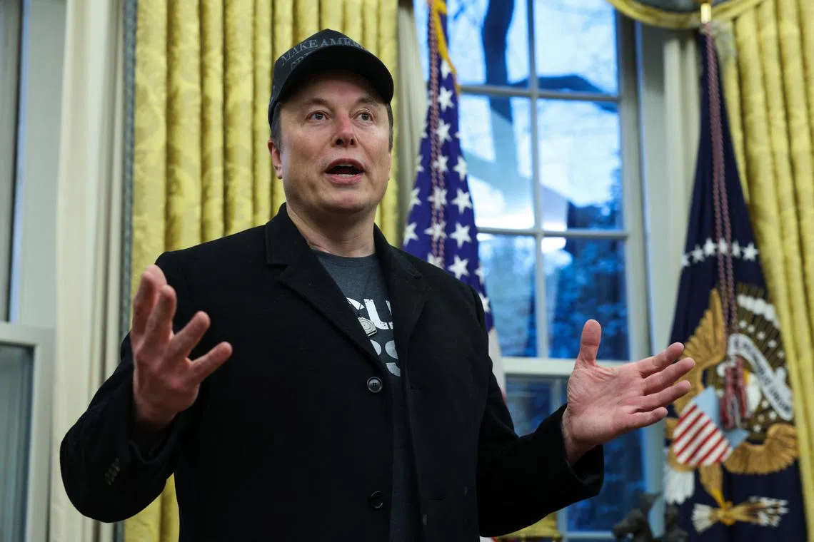 Elon Musk speaks next to U.S. President Donald Trump (not pictured) in the Oval Office of the White House in Washington, D.C., U.S., February 11, 2025.   REUTERS/Kevin Lamarque