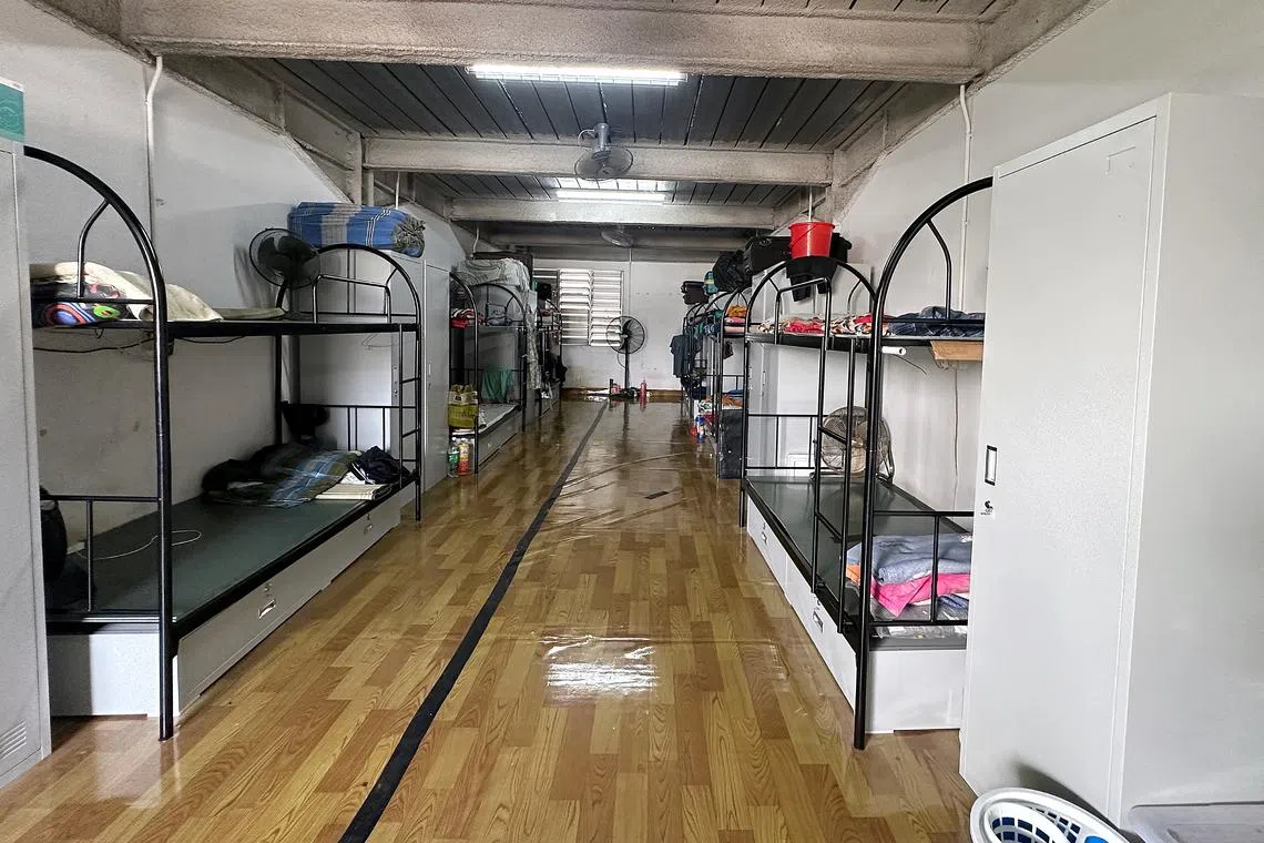 Pictured here on October 11, 2023 are 6 double decker beds meant for 12 foreign workers to dwell in the room at at PPT Lodge 1A, managed by Tee Up Dormitory. 8 Seletar North Link, 797455. A en suite toilet will be built at the white wall next to the fan. By 2030, about 1,000 foreign worker dormitories will need to meet an interim set of infrastructural standards meant to improve their ability to contain disease outbreaks. The Ministry of Manpower (MOM) said on Wednesday that by 2040, these 1,000 existing dorms will have to upgrade to even higher standards that were unveiled in 2021.