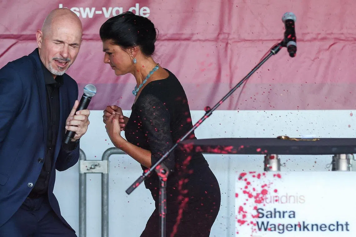 Left-wing German politician Sahra Wagenknecht reacting after red paint was thrown at a rally in the eastern German state of Thuringia, on Aug 29.