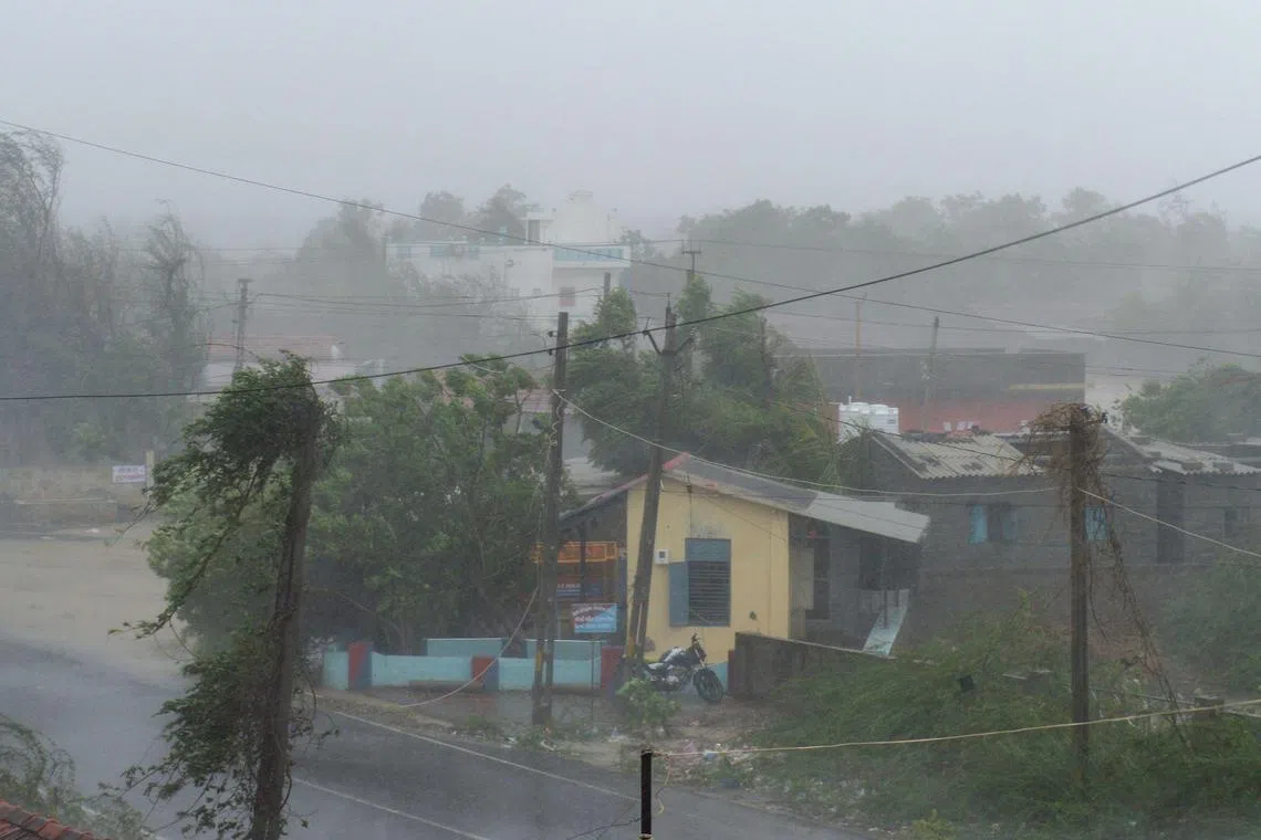 Heavy rain falls and strong winds blow through Mandvi town, some 100km south-east of Jakhau Port, India, after cyclone Biparjoy made landfall. 