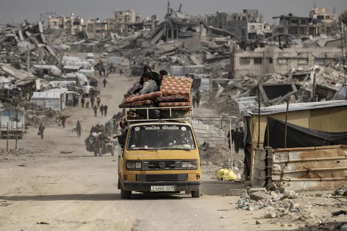 Displaced Palestinians moving their belongings to the centre of Gaza City on March 20, after Israel's military issued warnings to evacuate homes in northern Gaza.