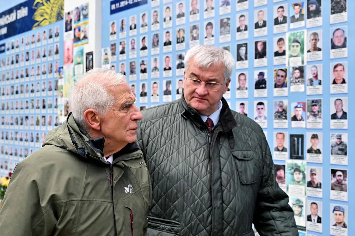 EU foreign policy chief Josep Borrell (left) and Ukrainian Foreign Minister Andrii Sybiha visiting the Memory Wall of Fallen Defenders of Ukraine in Kyiv, on Nov 9.