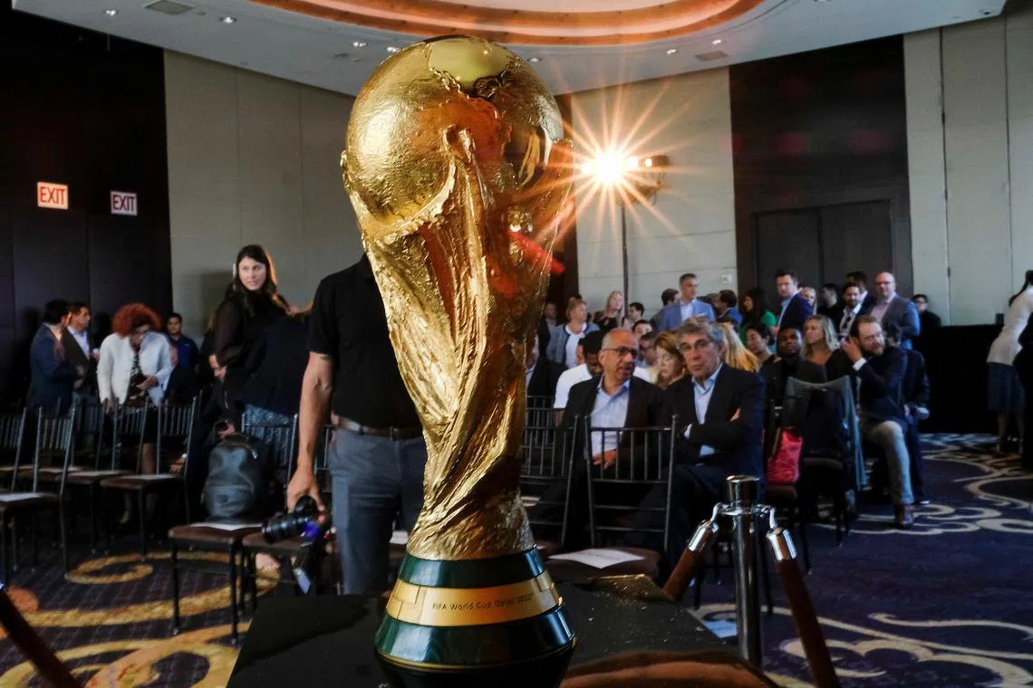 FILE PHOTO: The Official FIFA World Cup Trophy is seen before a news conference in New York City, New York, U.S., June 17, 2022.  REUTERS/Eduardo Munoz/File Photo