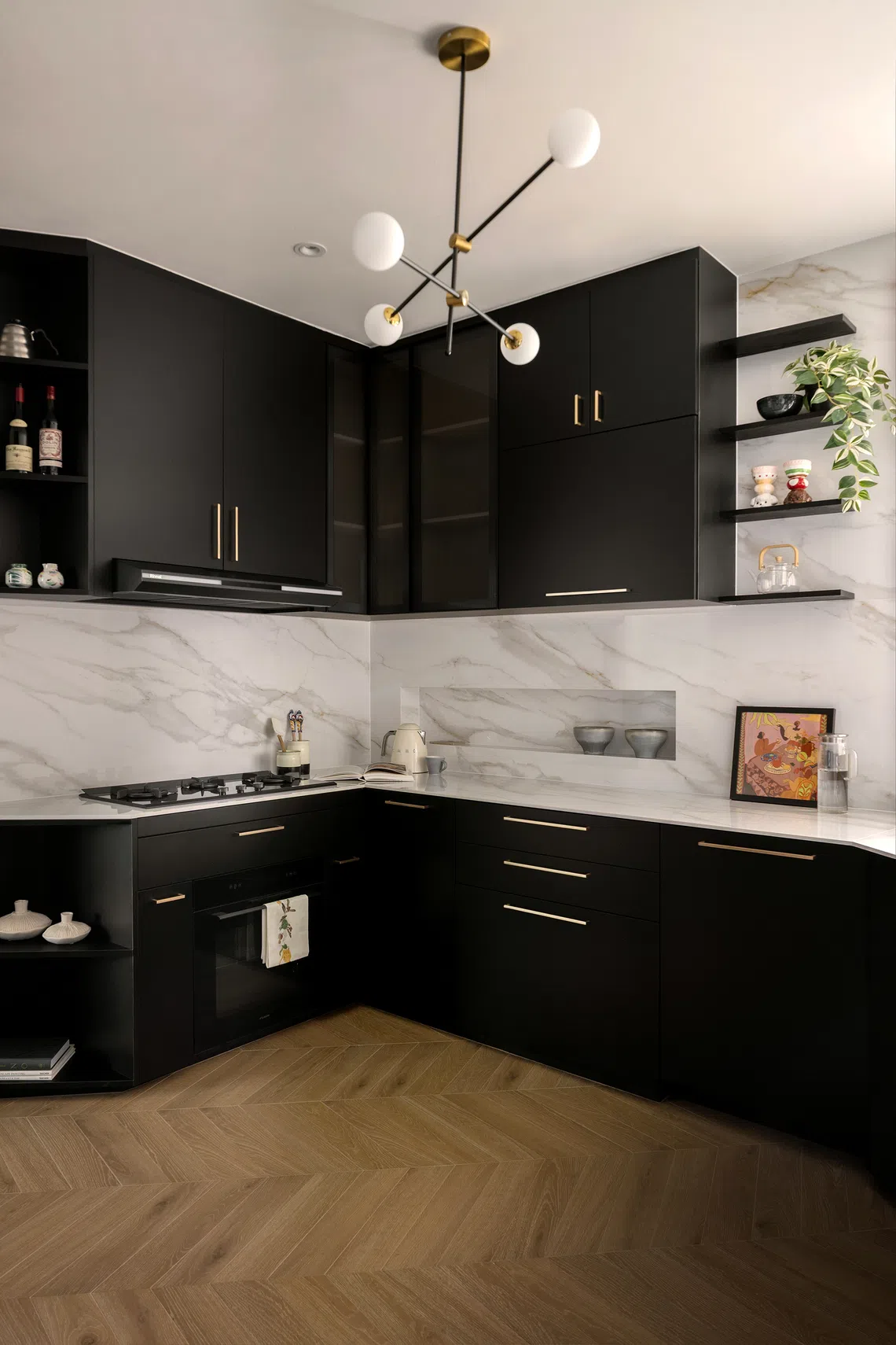 With its classic black-and-white palette and brass hardware, the kitchen is a nod to Mid-century Modern interiors.