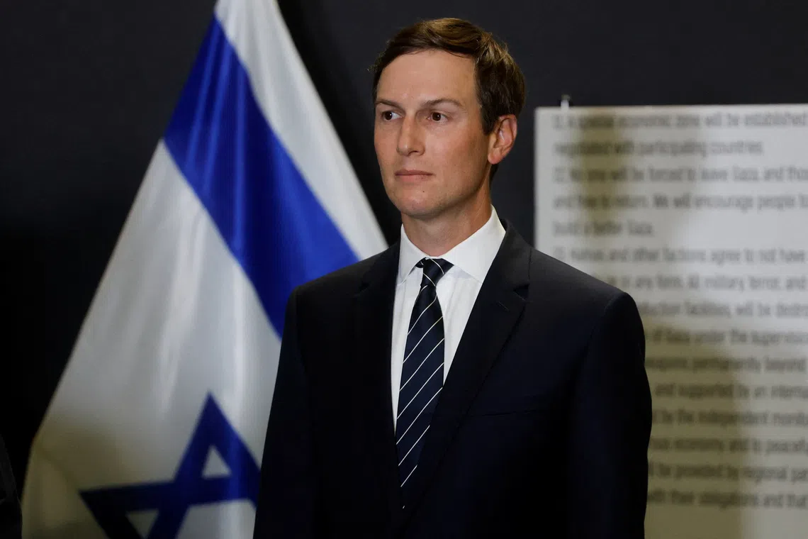 Jared Kushner listens as U.S. Vice President JD Vance (not pictured) speaks to members of the media in Kiryat Gat, Israel, October 21, 2025. REUTERS/Ammar Awad