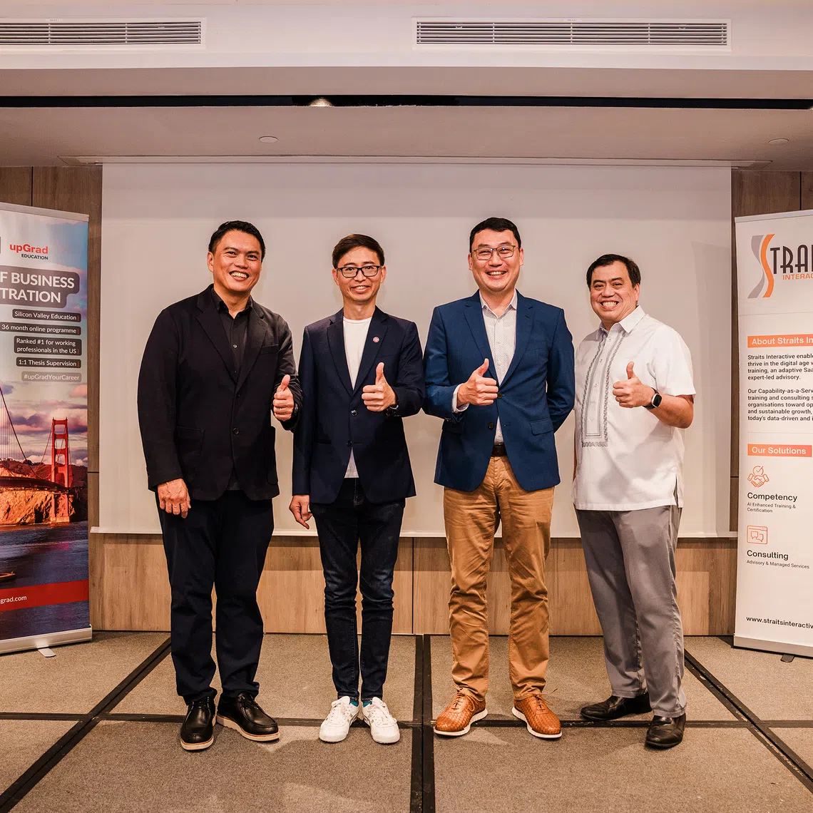 NTUC assistant secretary-general Patrick Tay announces the collaboration with ASME president Ang Yuit, SMU Academy executive director Jack Lim and Straits Interactive founder and CEO Kevin Shepherdson. 