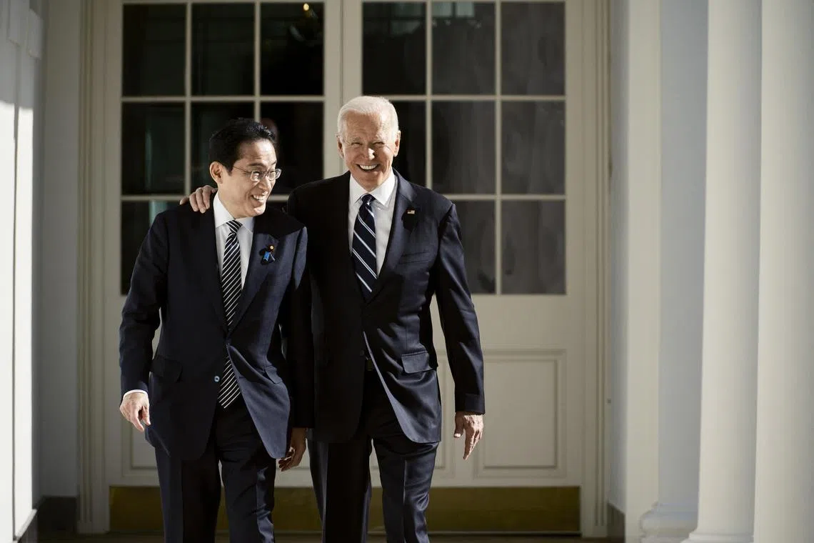 Japanese Prime Minister Kishida Fumio (left) and US President Joe Biden walk along the colonnade, towards the Oval Office, for a bilateral meeting at the White House, on Jan 13, 2023.