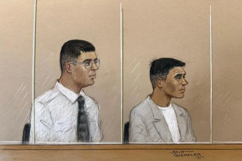 Nandito Badea and George Stana, two Romanian men accused of stabbing journalist Pouria Zeraati, appearing at Woolwich Crown Court in London, Britain, on May 18.